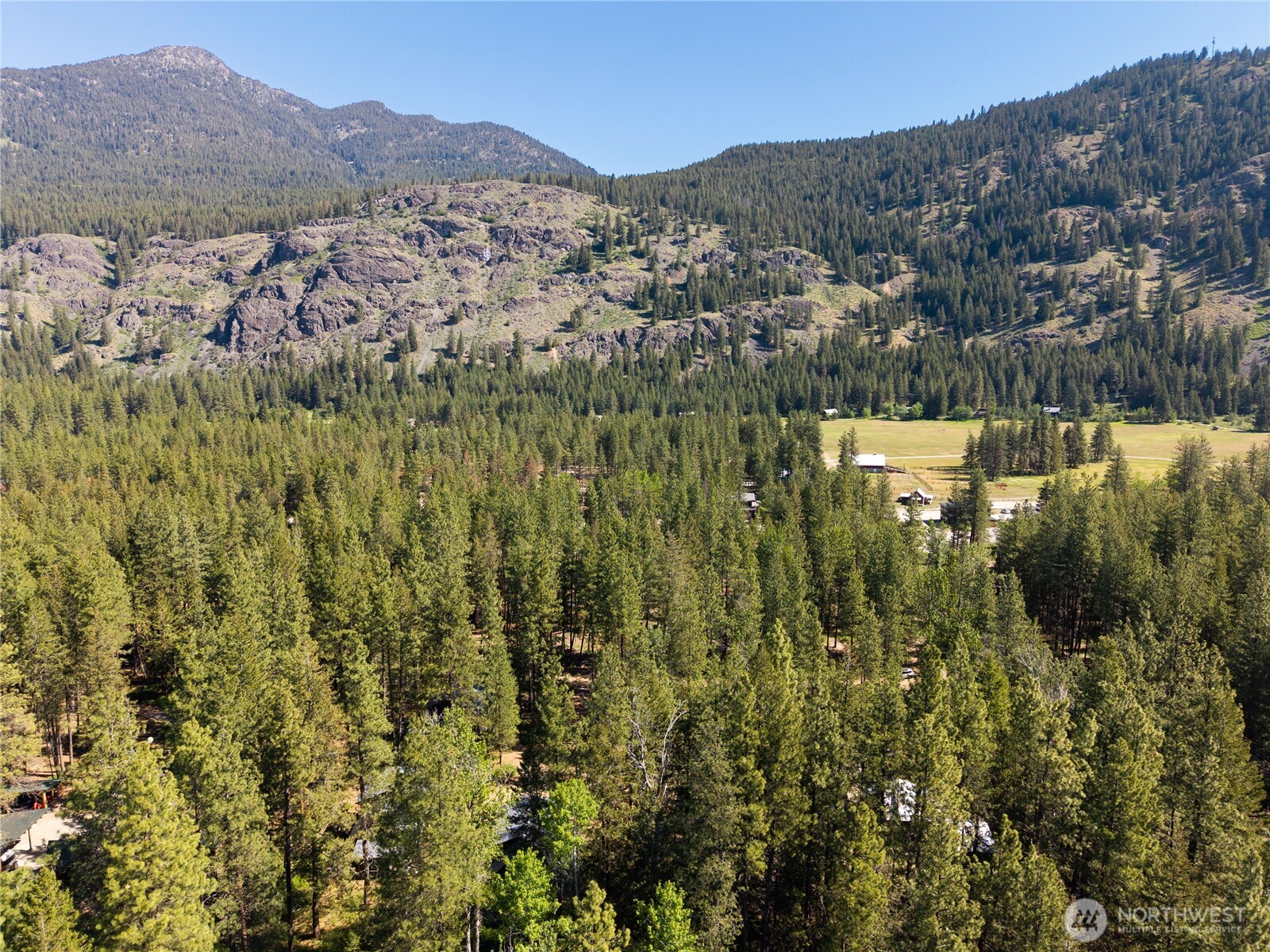 3 Mazama Bridge Road Mazama, WA 98833 - Photo 8 of 29 a view of a town with mountains in the background