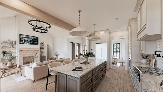a view of a dining room with furniture a chandelier and wooden floor