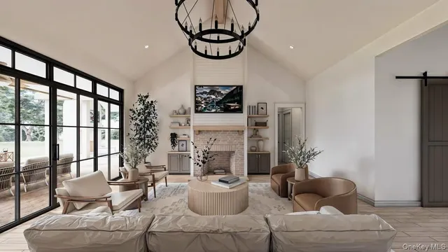 a living room with furniture and a floor to ceiling window