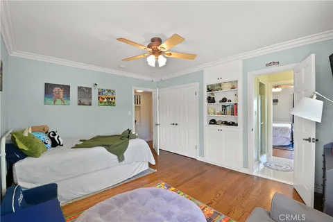 a bed room with a bed and a chandelier