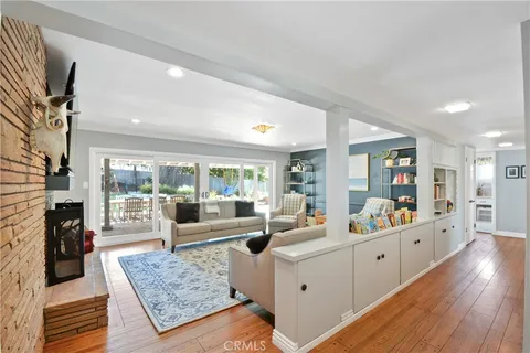 a large living room with furniture and a large window