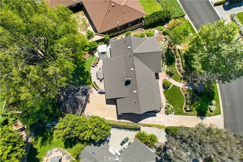 an aerial view of a house with a yard