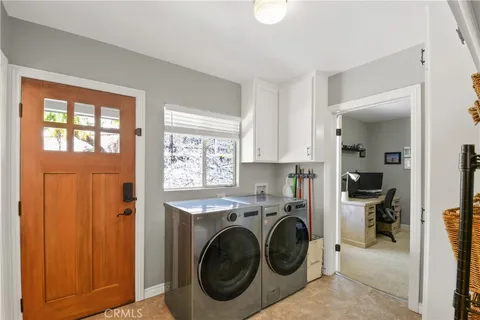 a view of a kitchen with washer and dryer