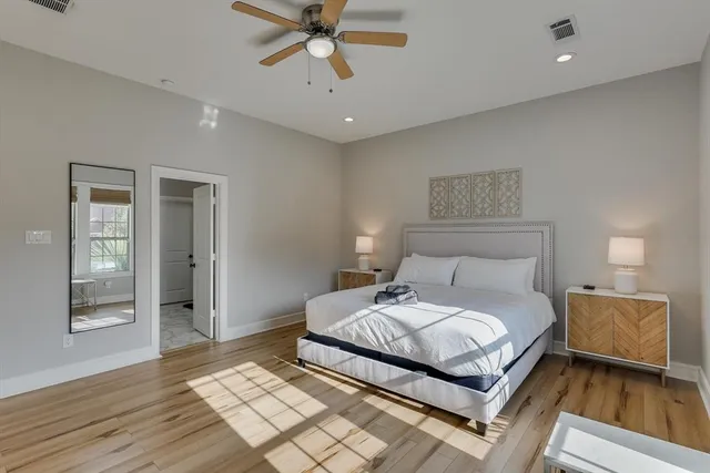 a bathroom with a double vanity sink toilet and shower