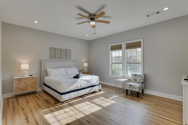 a bedroom with a bed and window