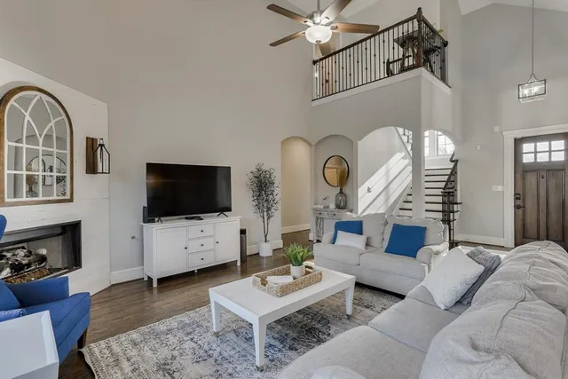 a living room with furniture or couch and a dining table