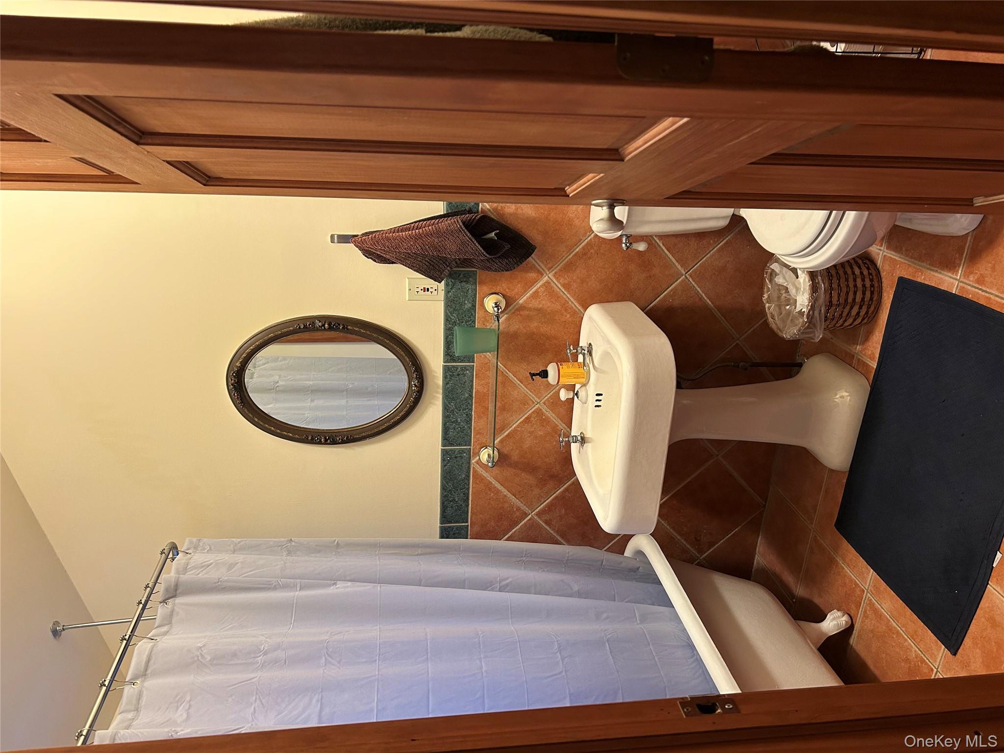 186 Taylor Road Cornwall, NY 10953 - Photo 19 of 26 Bathroom with toilet, tile patterned flooring, and tile walls