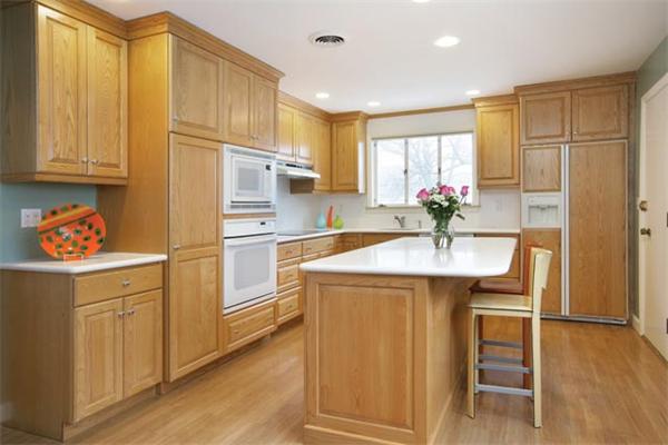 124 Arlington Road Brookline, MA 02467 - Photo 5 of 6 a kitchen with kitchen island granite countertop a sink cabinets and stainless steel appliances