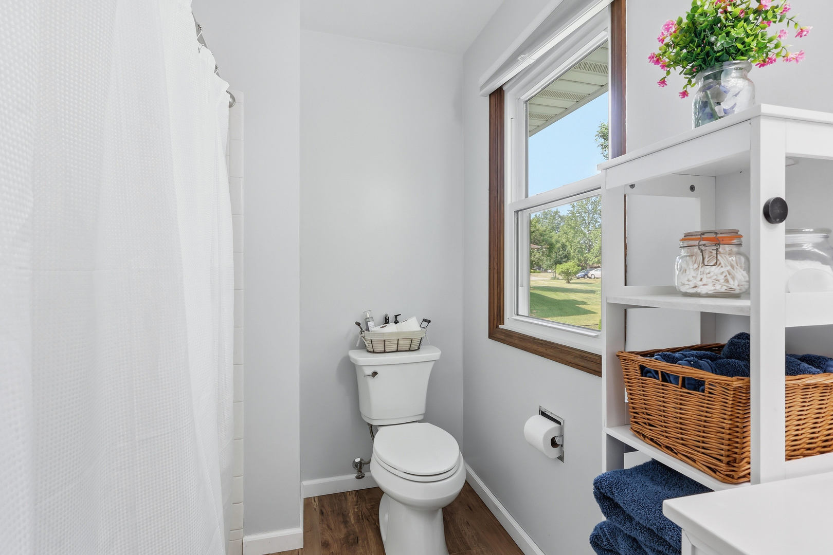 4314 Spring Street Davenport, IA 52807 - Photo 33 of 51 a bathroom with a toilet and a potted plant