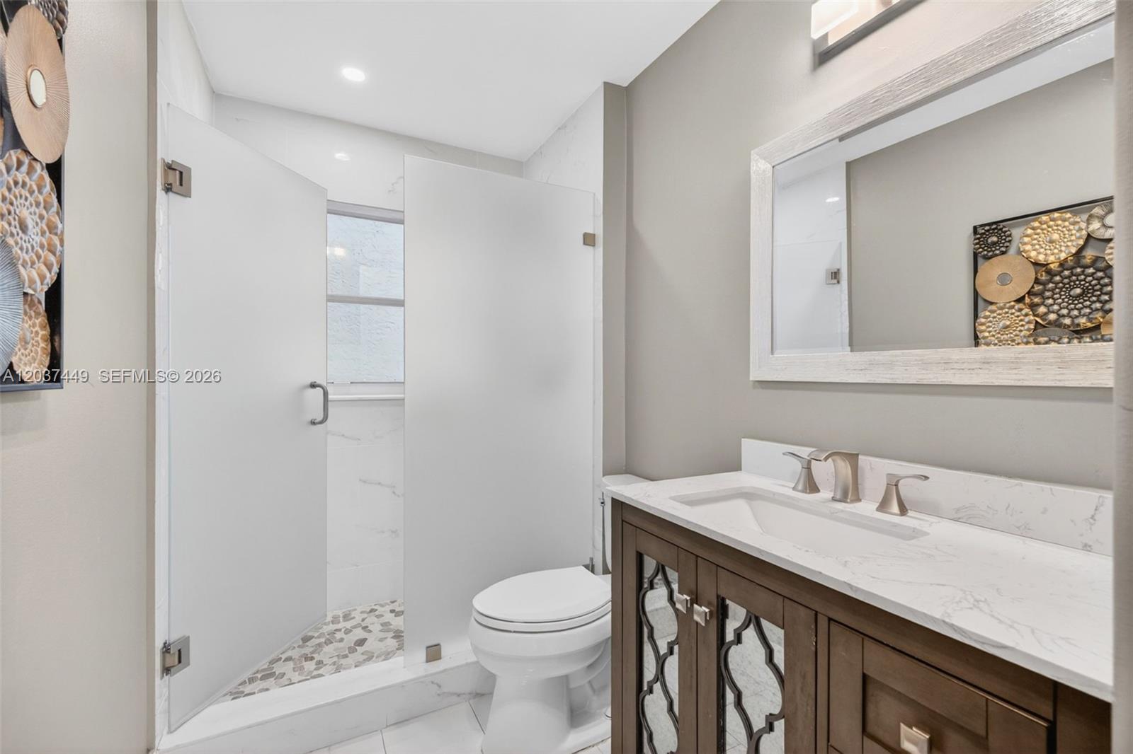 17488 Southwest 28th Court Miramar, FL 33029 - Photo 35 of 50 a bathroom with a sink toilet and shower