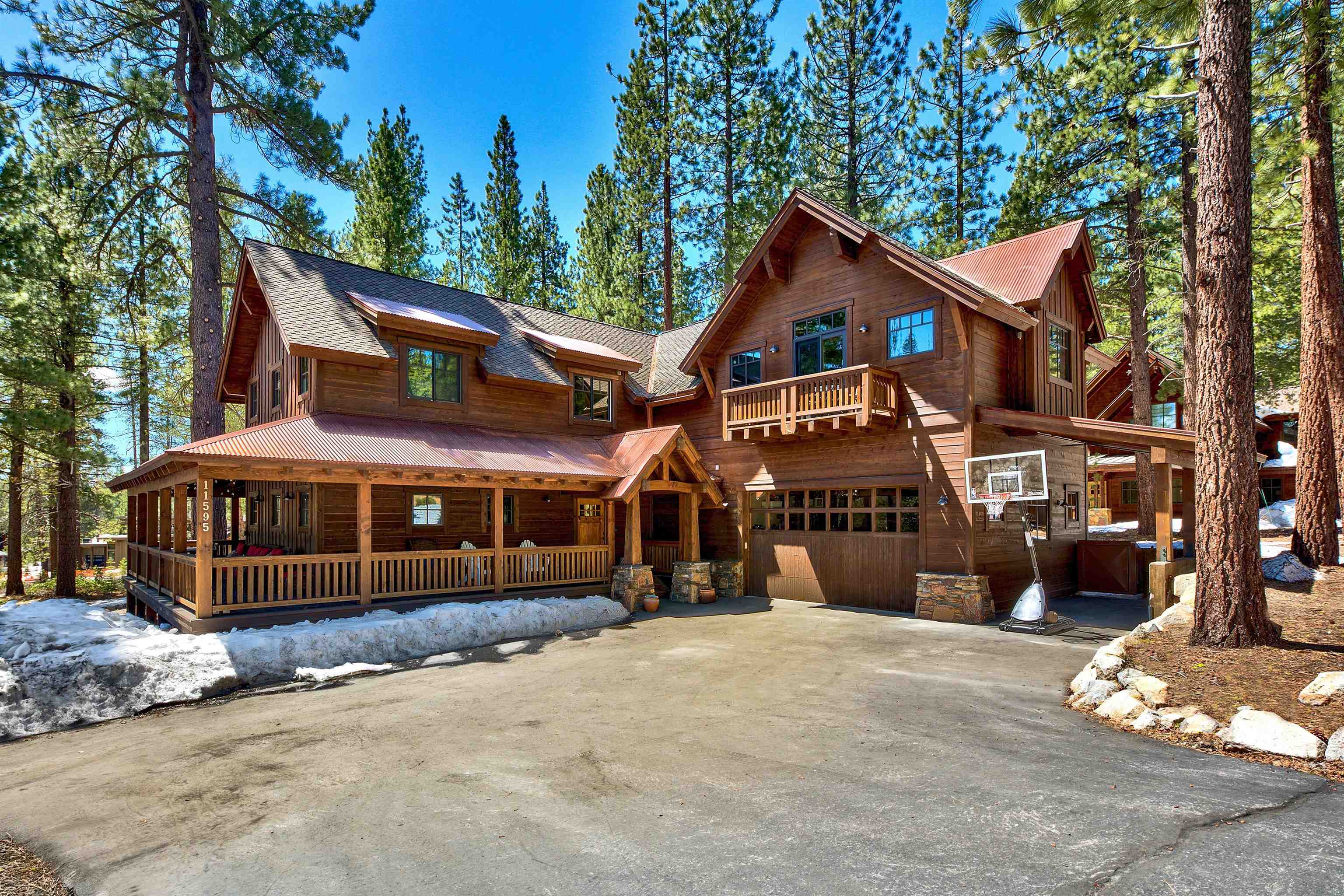11595 Kelley Drive Truckee, CA 96161 - Photo 1 of 21 a front view of a house with a yard and parking space