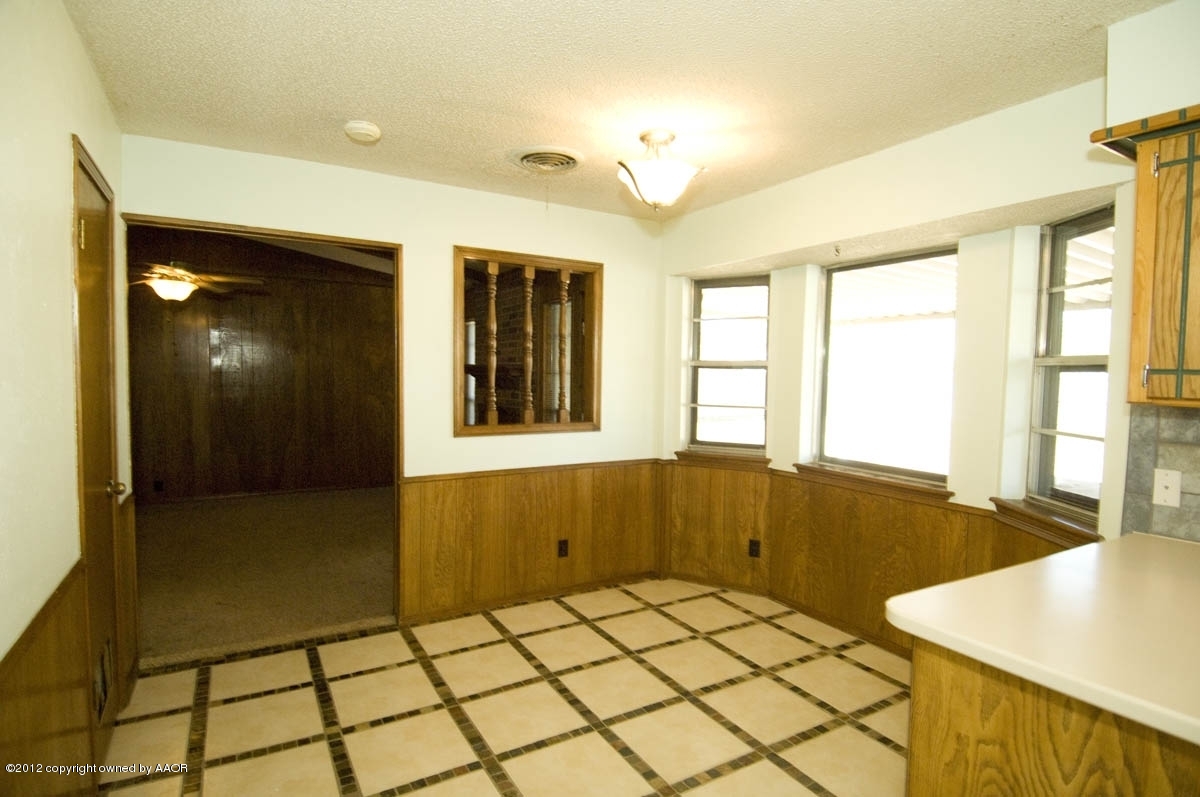 8206 Santa Fe Trail Amarillo, TX 79110 - Photo 12 of 31 a bathroom with a granite countertop sink and a large mirror