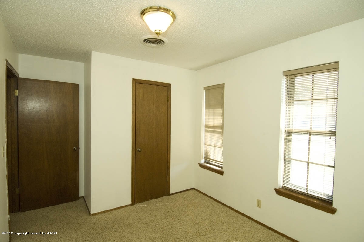8206 Santa Fe Trail Amarillo, TX 79110 - Photo 20 of 31 a view of an empty room with a window