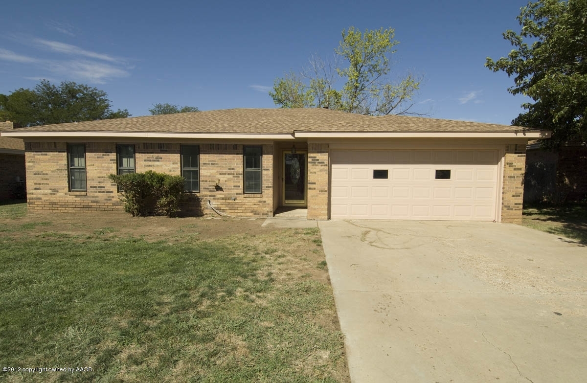 8206 Santa Fe Trail Amarillo, TX 79110 - Photo 2 of 31 a front view of a house with a yard