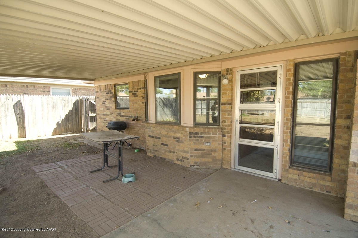 8206 Santa Fe Trail Amarillo, TX 79110 - Photo 28 of 31 a room with multiple glass windows with table and chairs