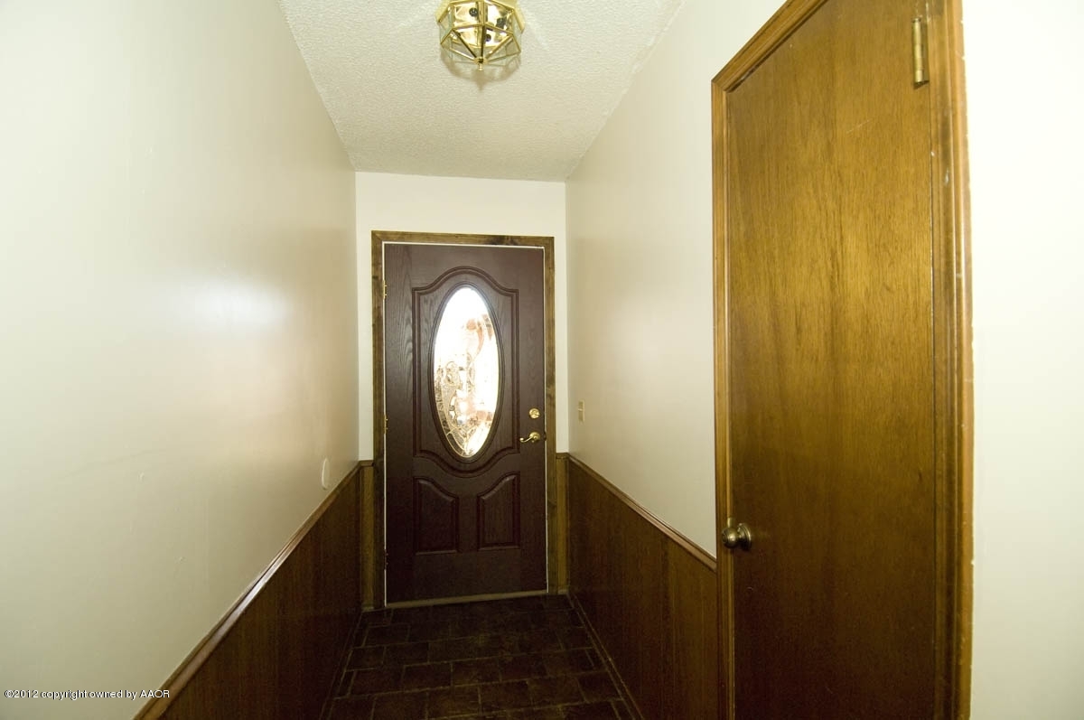 8206 Santa Fe Trail Amarillo, TX 79110 - Photo 4 of 31 a bathroom with a sink and a mirror