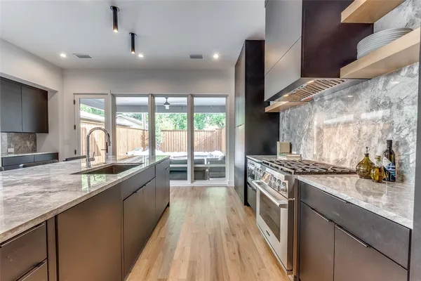 a kitchen with a stove and a sink