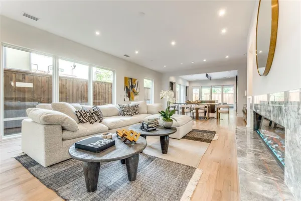 a living room with lots of furniture and a table