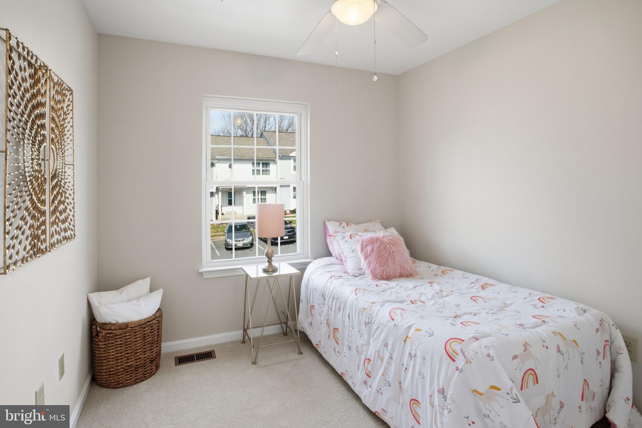 5251 Spring Branch Boulevard Dumfries, VA 22025 - Photo 13 of 25 a bedroom with a bed and a window