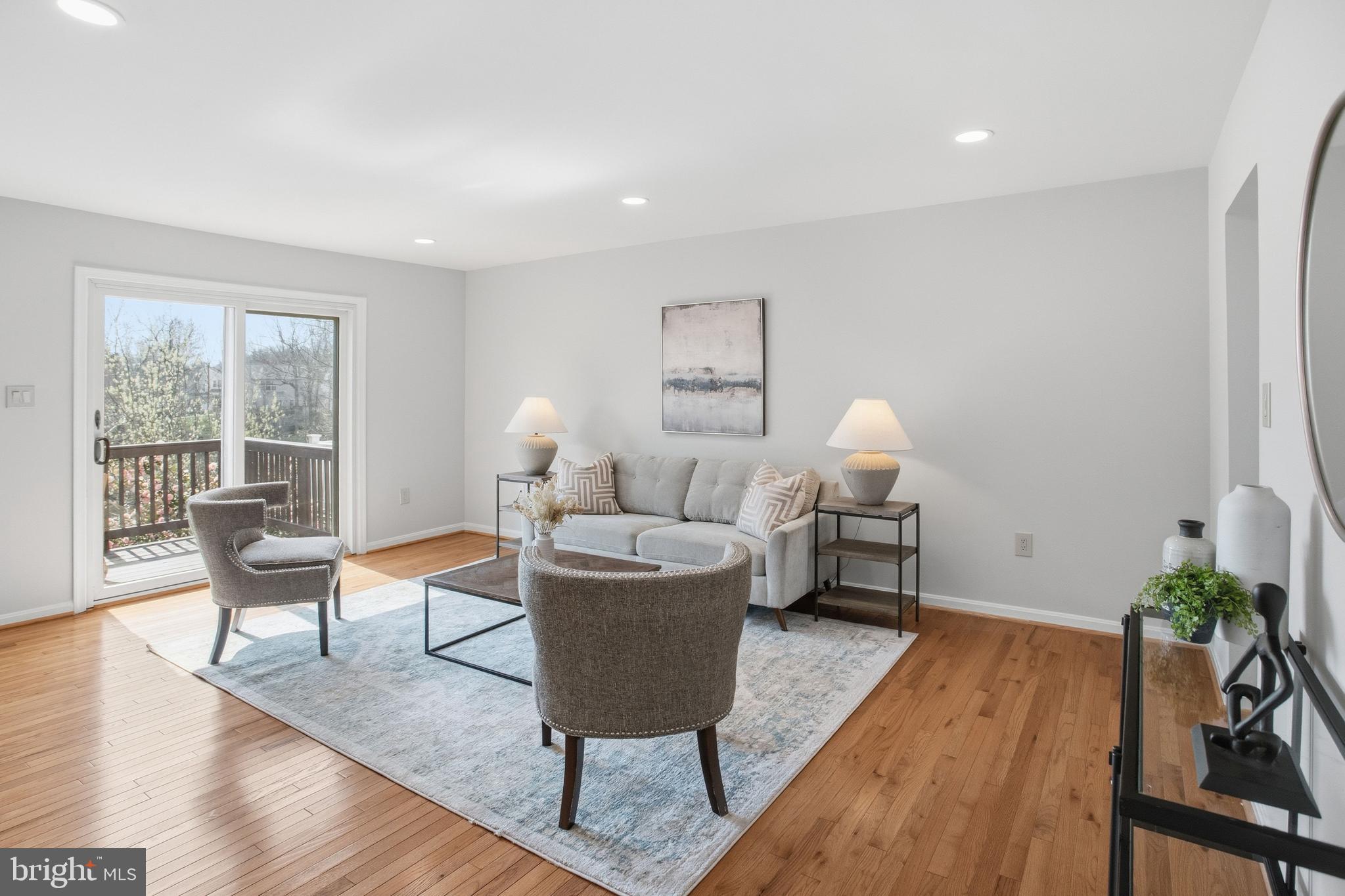 5251 Spring Branch Boulevard Dumfries, VA 22025 - Photo 2 of 25 a living room with furniture and a wooden floor