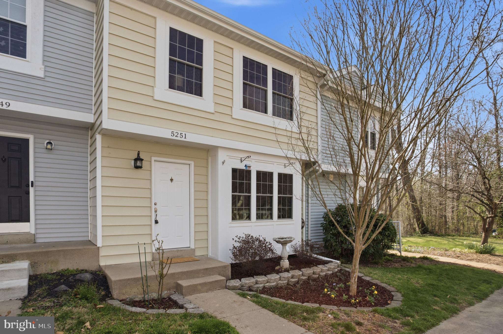 5251 Spring Branch Boulevard Dumfries, VA 22025 - Photo 24 of 25 a front view of a house with a yard