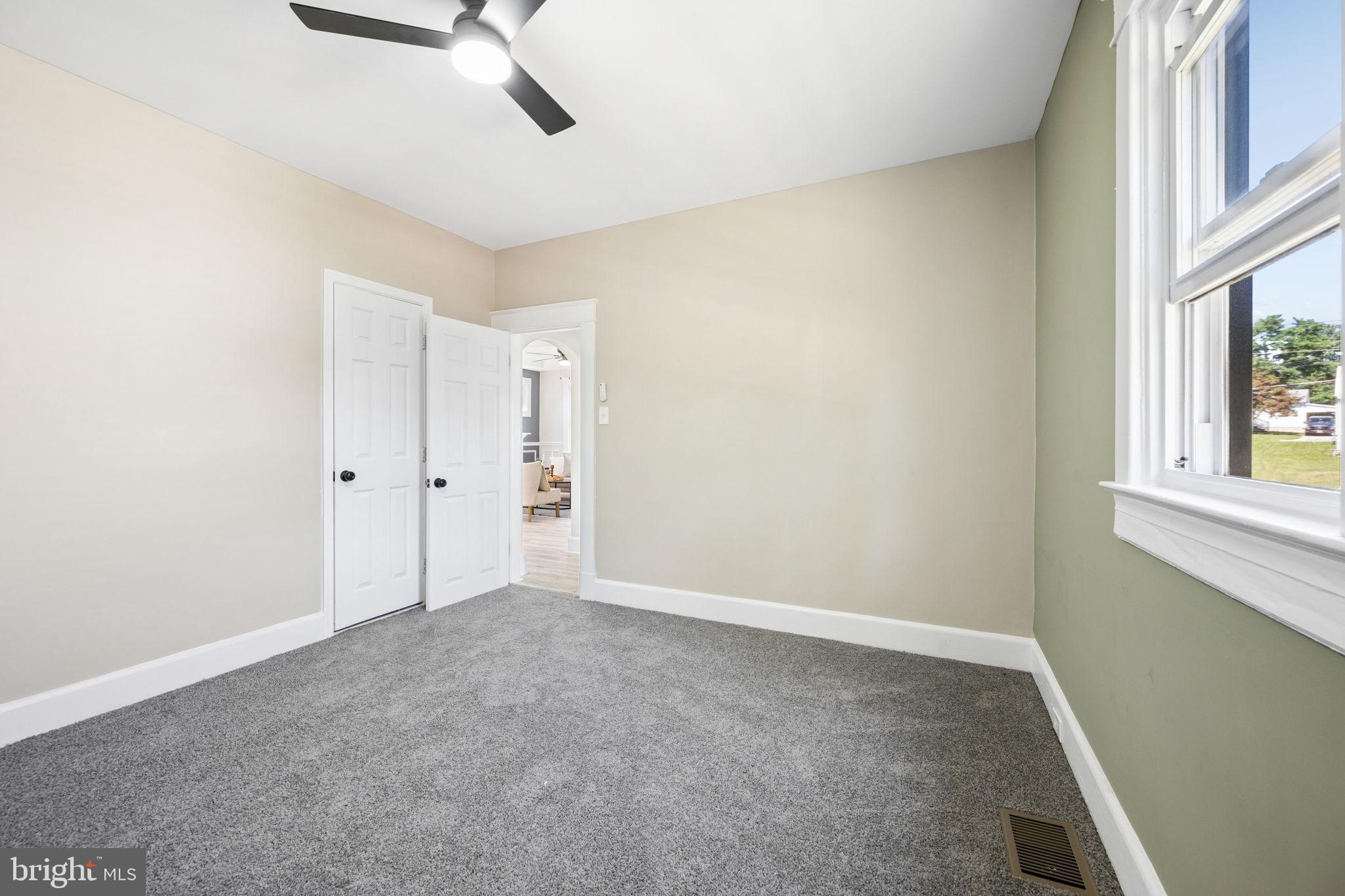 517 Valcour Road Baltimore, MD 21228 - Photo 27 of 47 a view of an empty room with a window