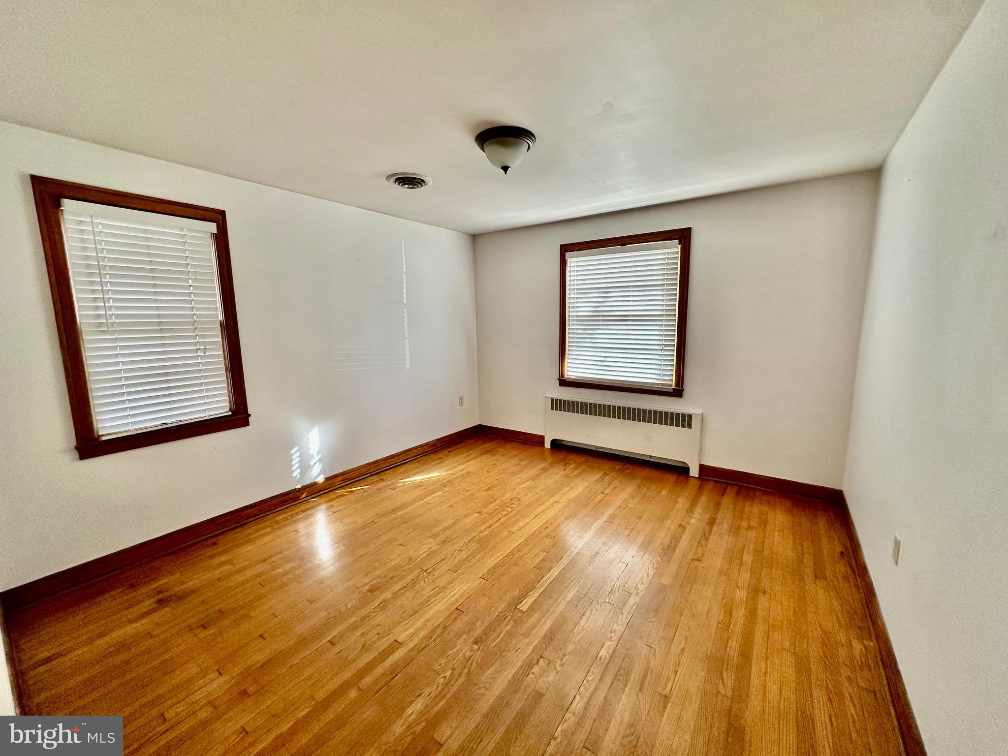 939 View Street Hagerstown, MD 21742 - Photo 13 of 24 a view of an empty room with wooden floor and a window