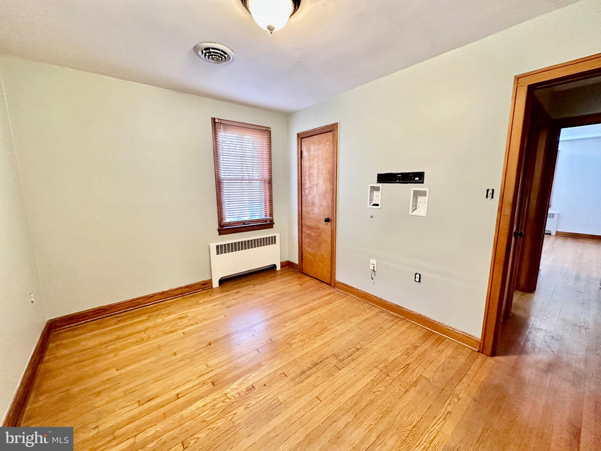 939 View Street Hagerstown, MD 21742 - Photo 14 of 24 a view of an empty room with wooden floor and a window