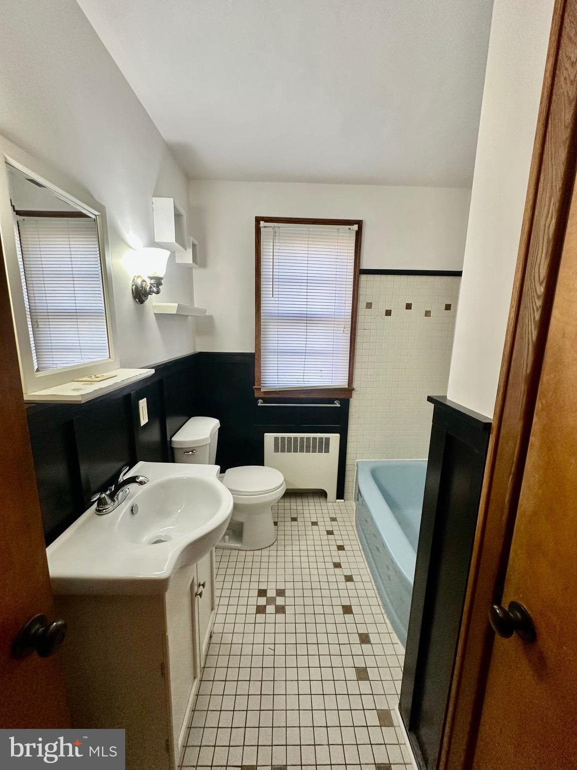 939 View Street Hagerstown, MD 21742 - Photo 17 of 24 a bathroom with a sink a toilet and mirror