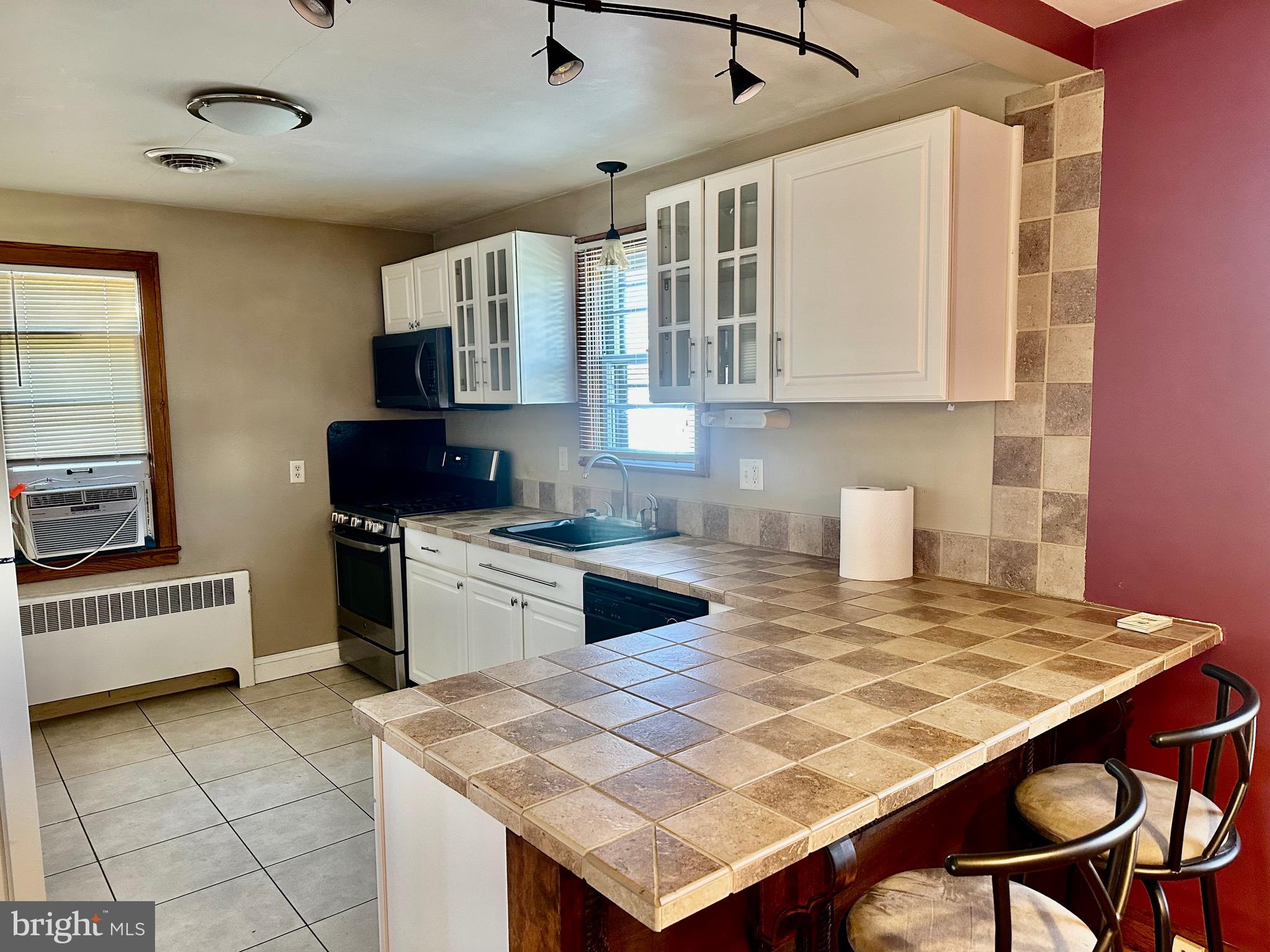 939 View Street Hagerstown, MD 21742 - Photo 8 of 24 a kitchen with a stove a sink and a refrigerator