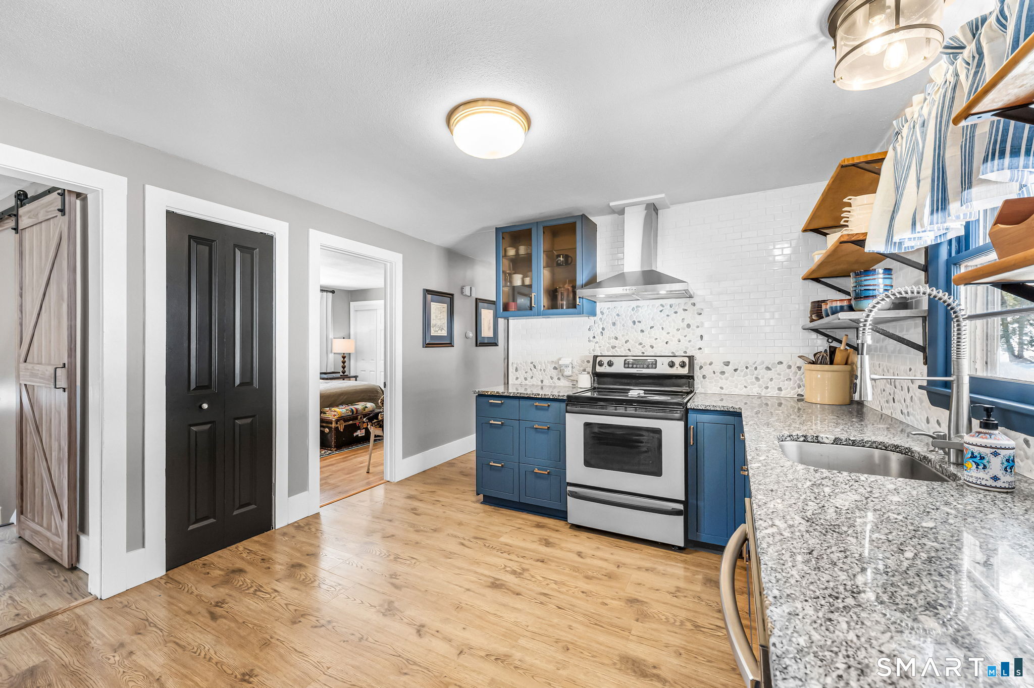 9 Hale Road Enfield, CT 06082 - Photo 11 of 40 a kitchen with stainless steel appliances granite countertop a stove and a refrigerator