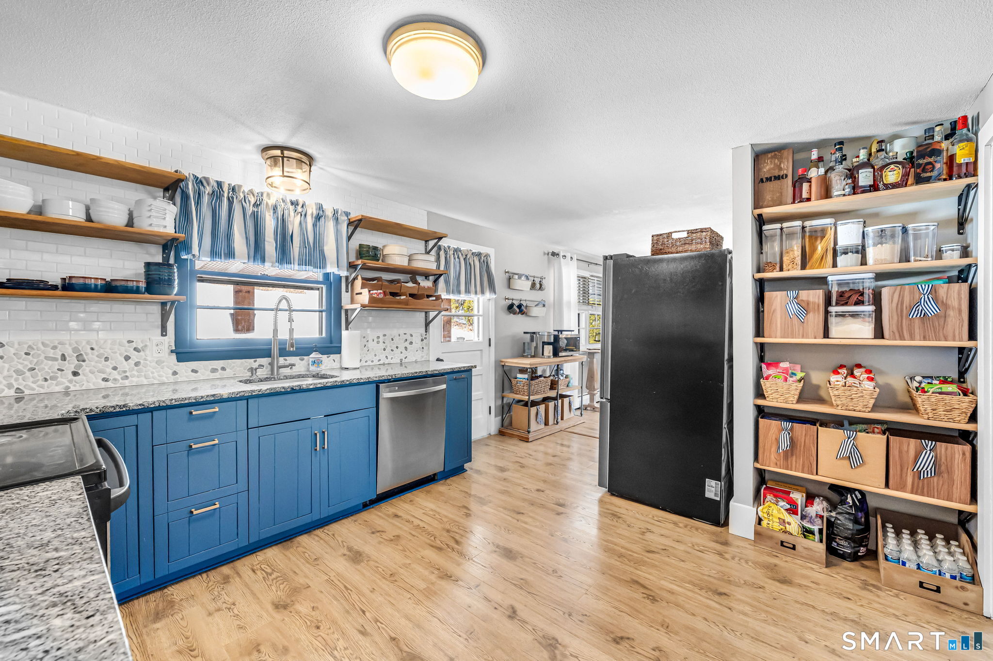 9 Hale Road Enfield, CT 06082 - Photo 13 of 40 a kitchen with stainless steel appliances granite countertop a refrigerator a stove and a wooden cabinets