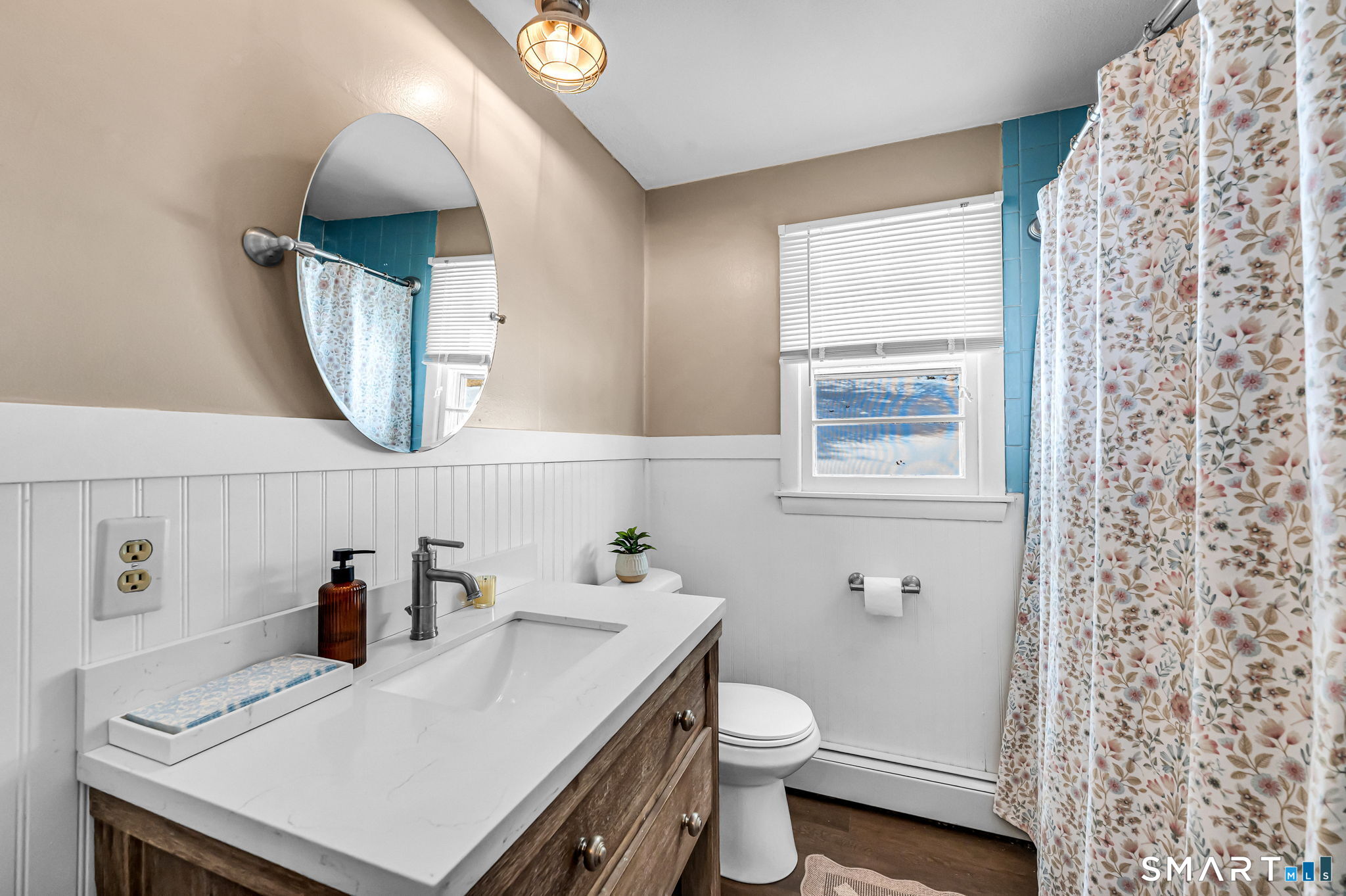 9 Hale Road Enfield, CT 06082 - Photo 15 of 40 a bathroom with a sink a toilet and mirror