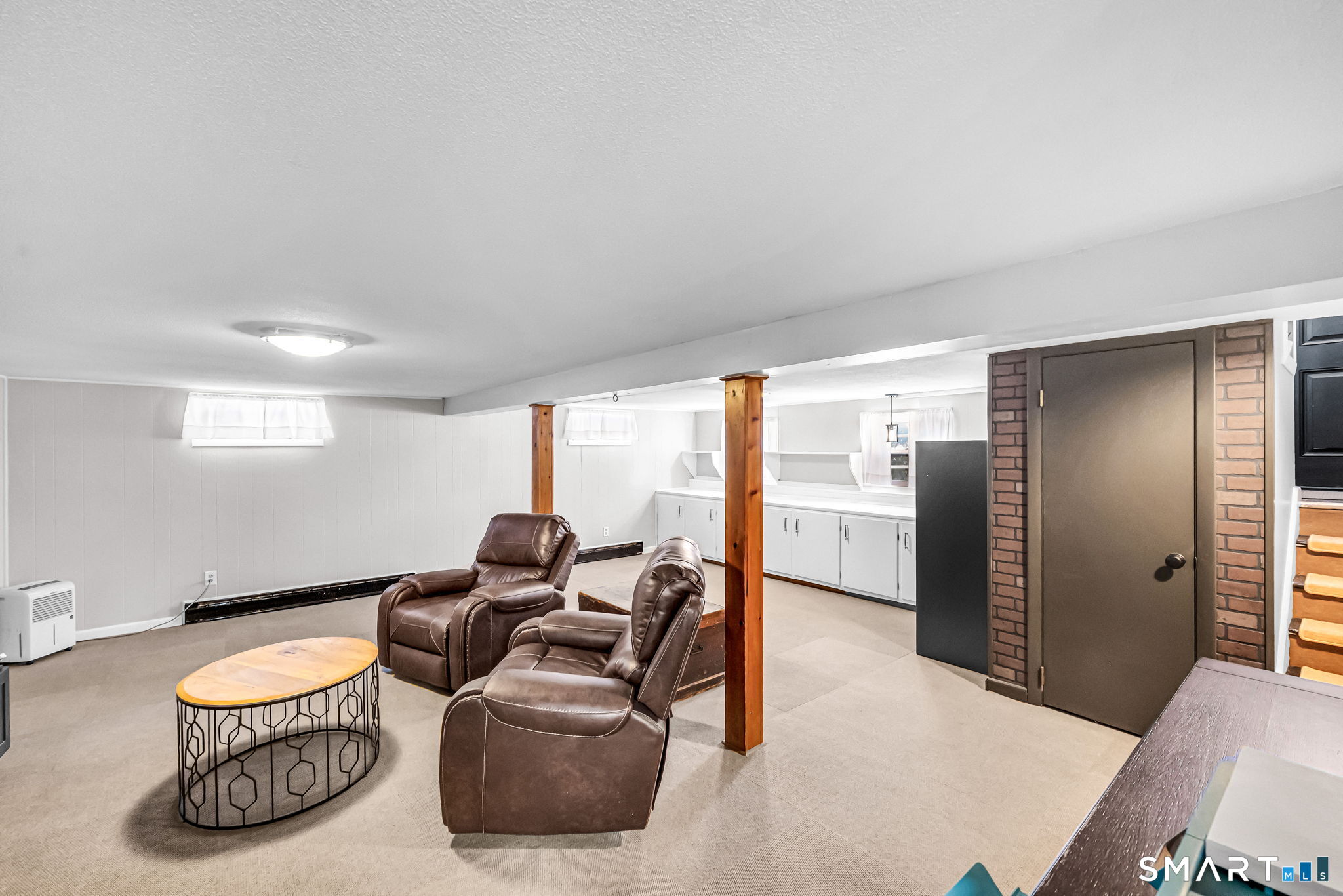 9 Hale Road Enfield, CT 06082 - Photo 28 of 40 a living room with furniture a ceiling fan and a rug