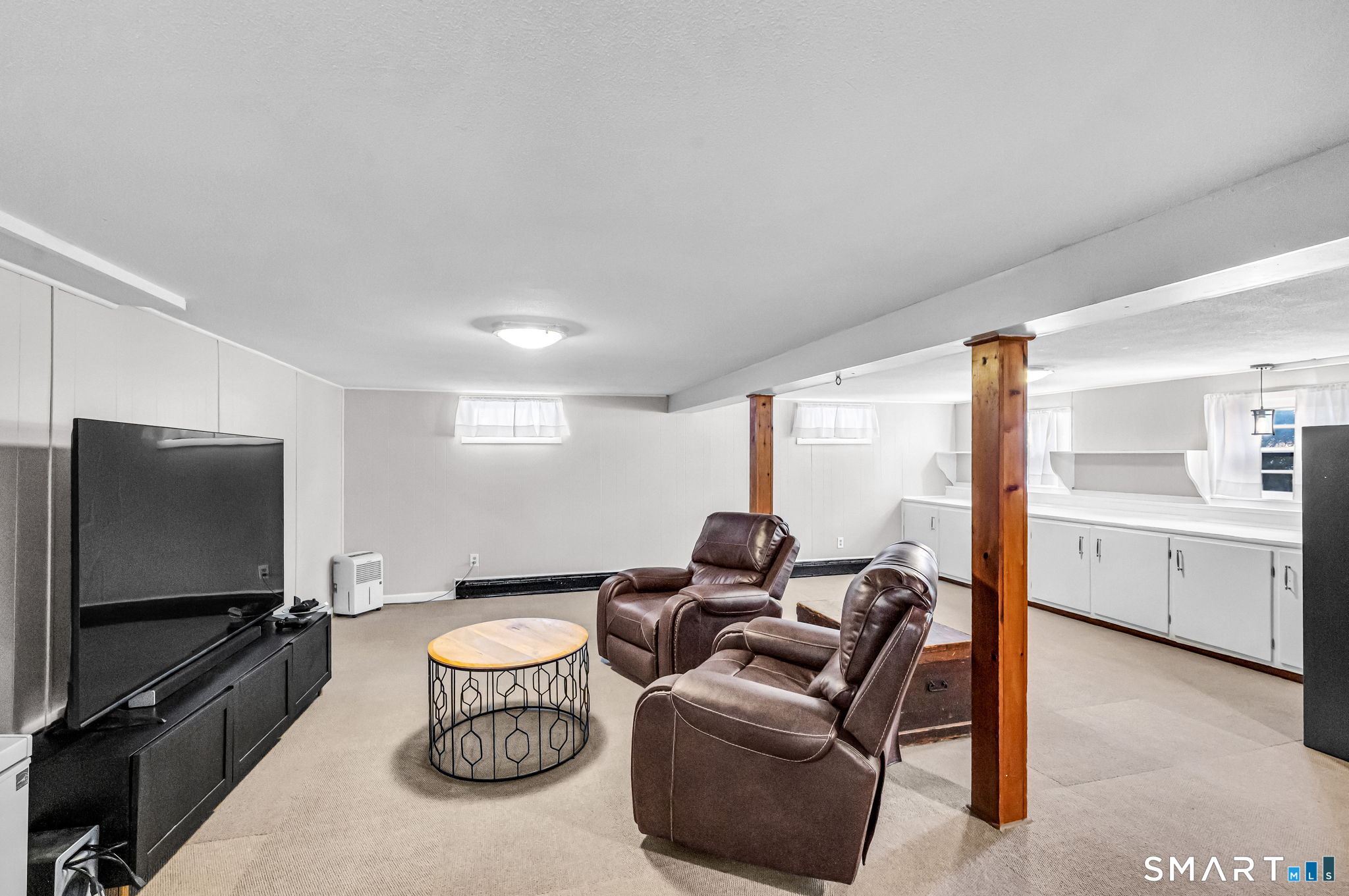 9 Hale Road Enfield, CT 06082 - Photo 29 of 40 a living room with furniture and a flat screen tv