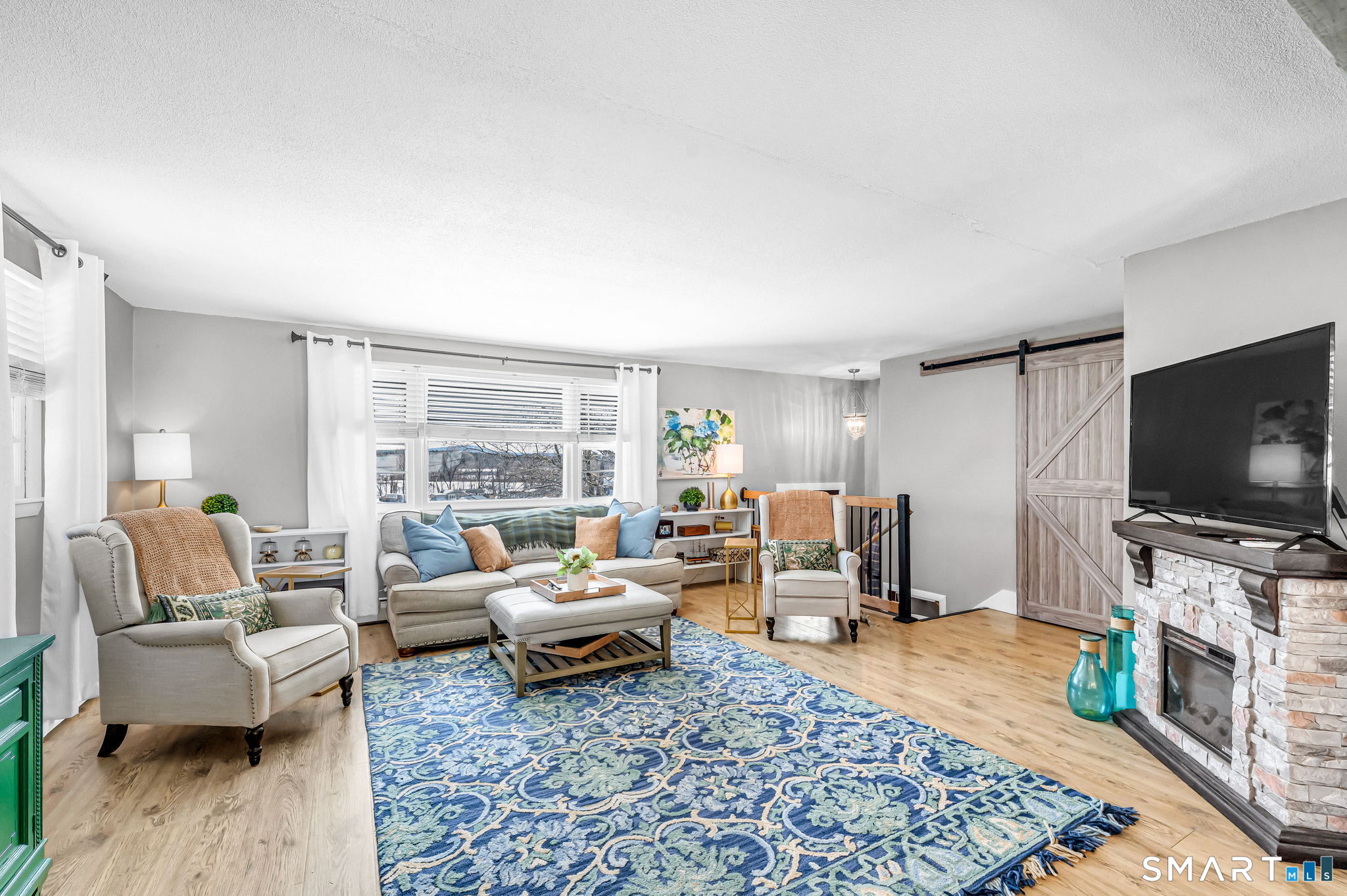 9 Hale Road Enfield, CT 06082 - Photo 3 of 40 a living room with furniture and a flat screen tv