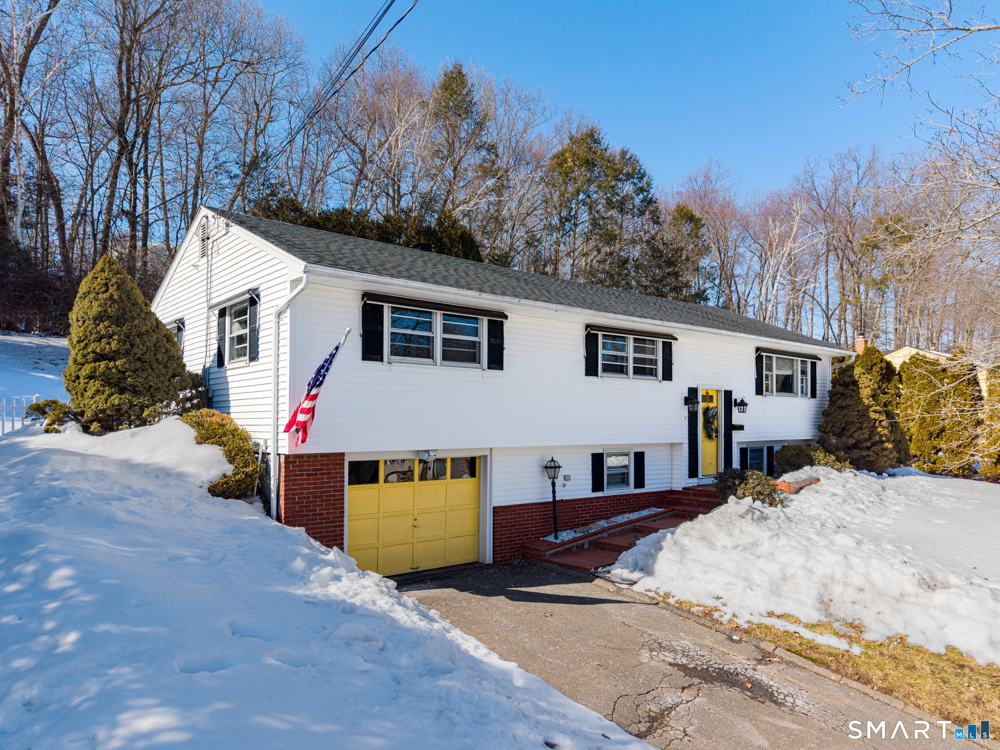 9 Hale Road Enfield, CT 06082 - Photo 31 of 40 a view of a house with a yard covered in snow
