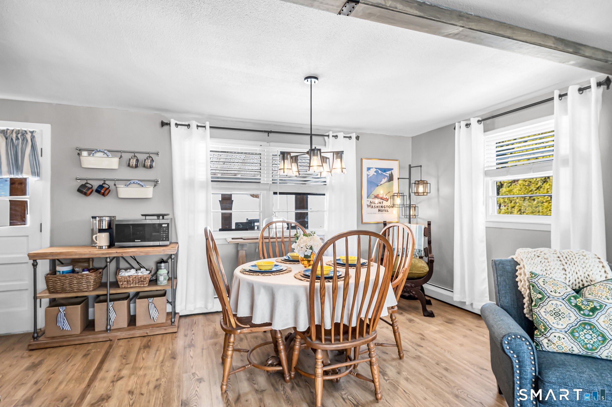 9 Hale Road Enfield, CT 06082 - Photo 6 of 40 a dining room with furniture a chandelier and wooden floor
