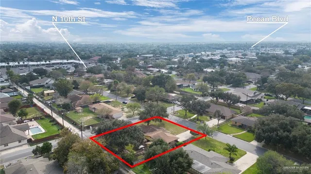 an aerial view of residential houses with outdoor space