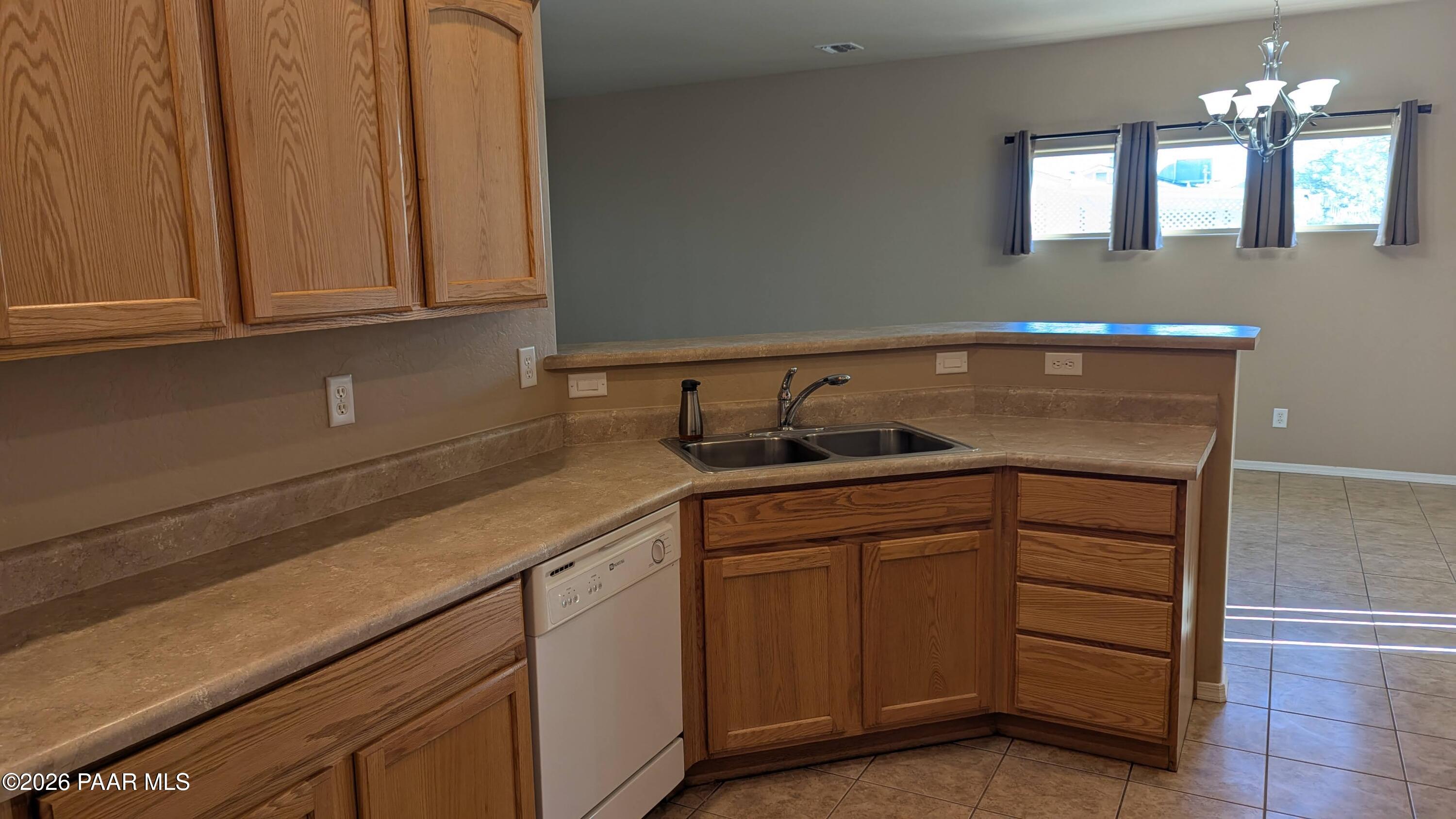 3416 North Victor Road, Unit 1 Prescott Valley, AZ 86314 - Photo 13 of 27 a kitchen with cabinets and a sink