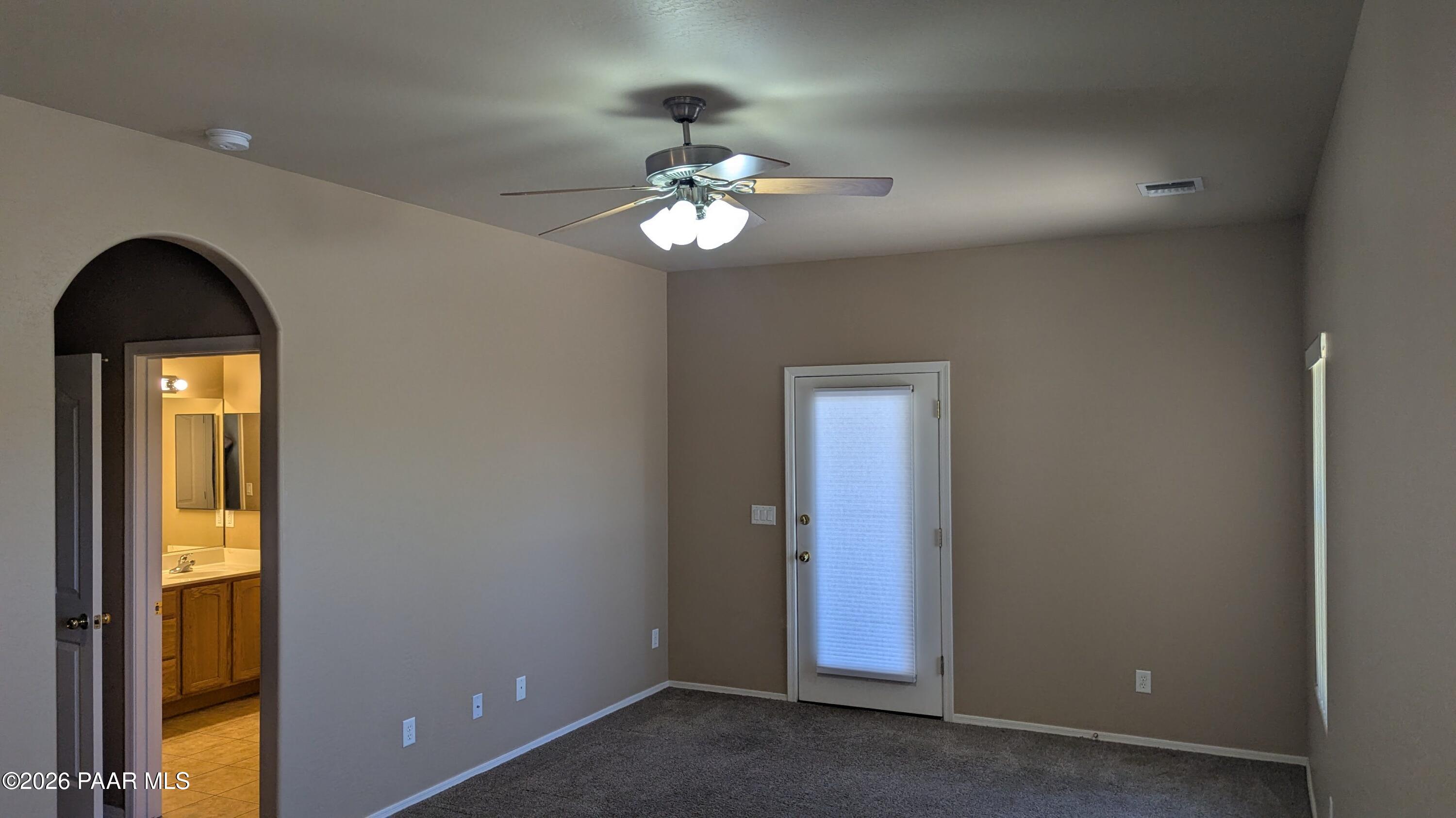3416 North Victor Road, Unit 1 Prescott Valley, AZ 86314 - Photo 17 of 27 a view of a livingroom with a chandelier