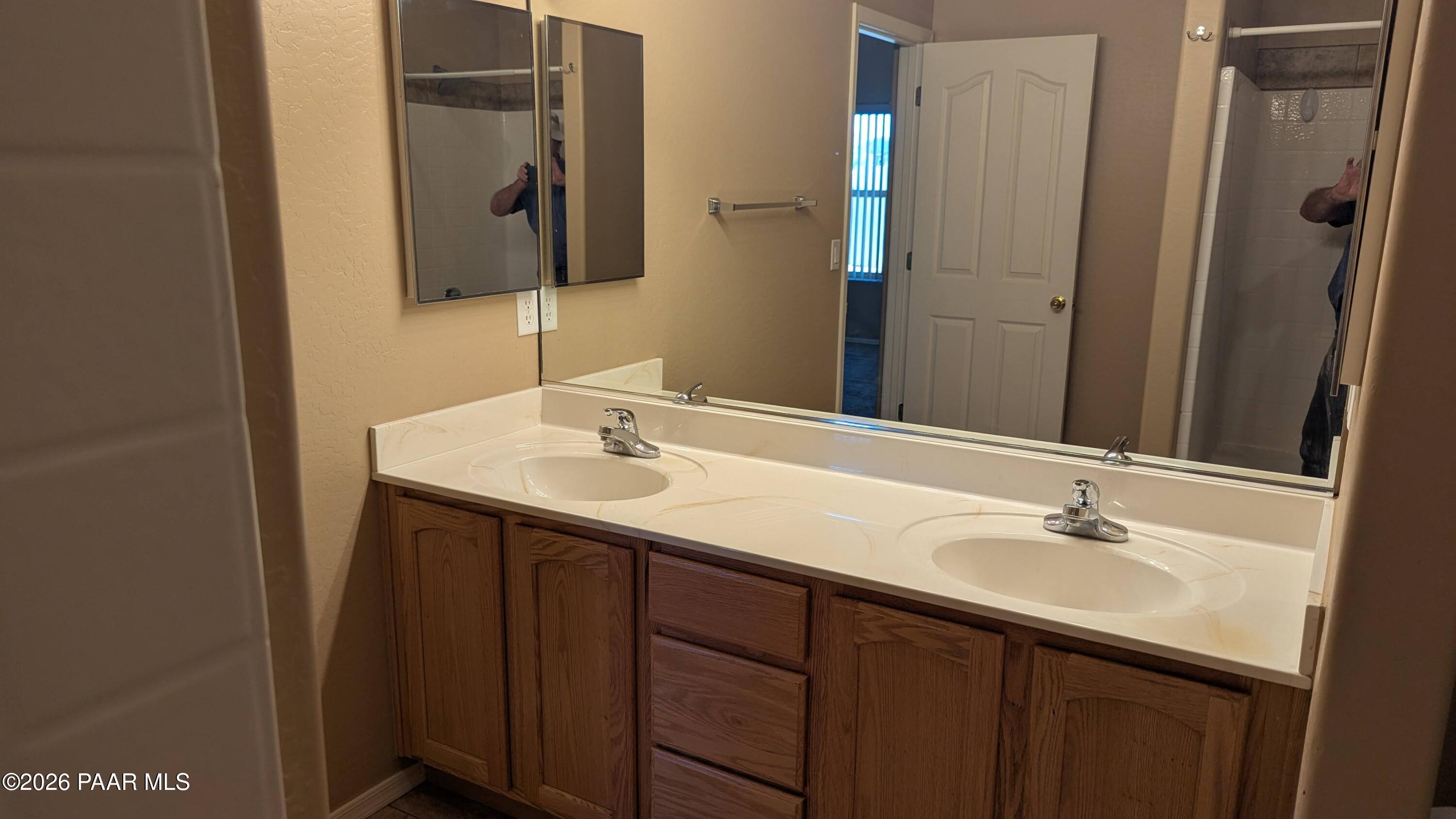3416 North Victor Road, Unit 1 Prescott Valley, AZ 86314 - Photo 20 of 27 a bathroom with a sink and a mirror