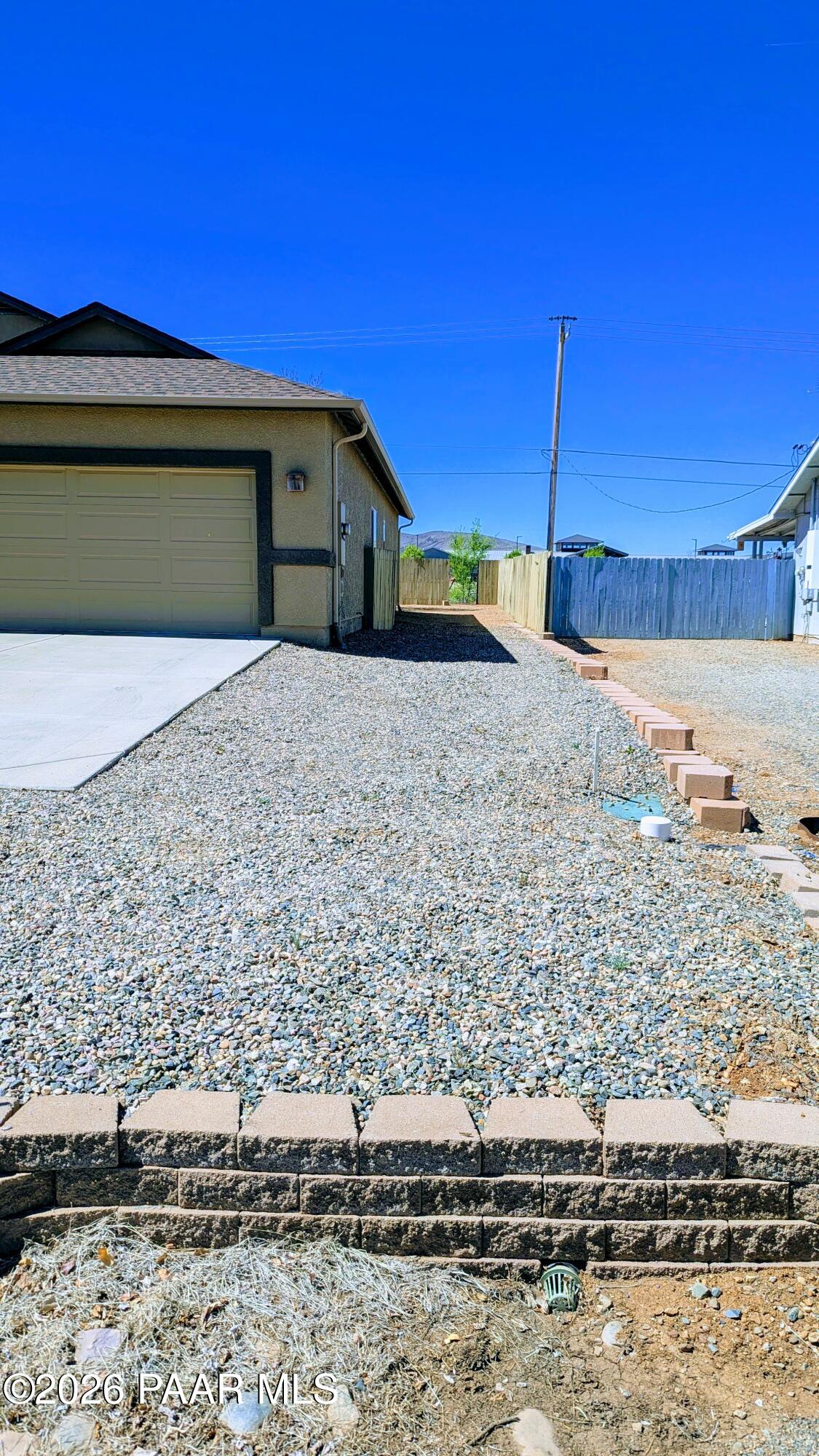 3416 North Victor Road, Unit 1 Prescott Valley, AZ 86314 - Photo 25 of 27 a front view of a house with a yard