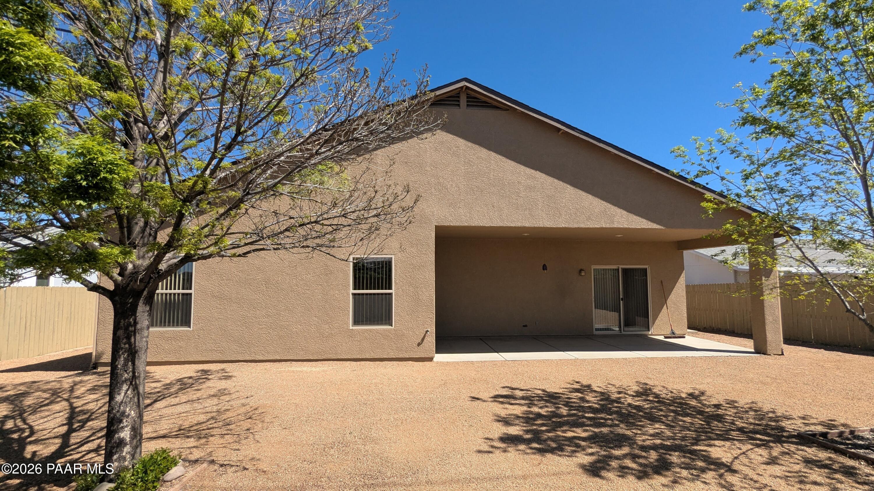 3416 North Victor Road, Unit 1 Prescott Valley, AZ 86314 - Photo 26 of 27 a front view of a house with a yard