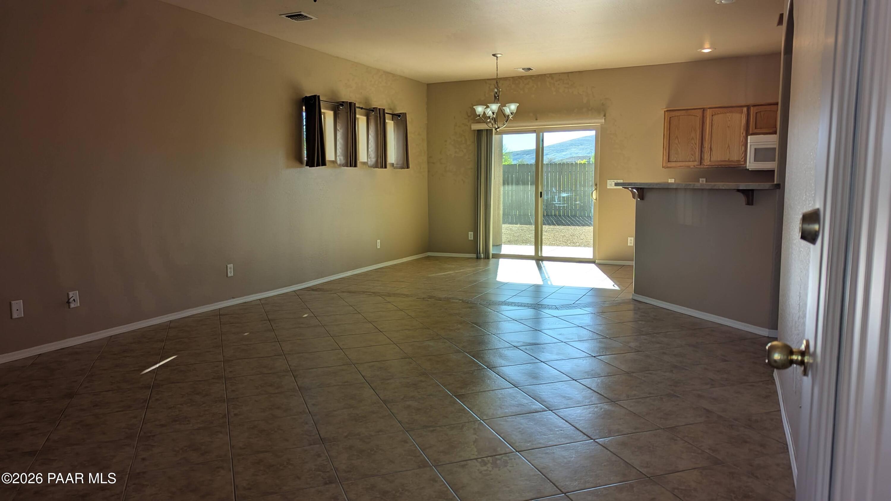 3416 North Victor Road, Unit 1 Prescott Valley, AZ 86314 - Photo 6 of 27 a view of an empty room with a window