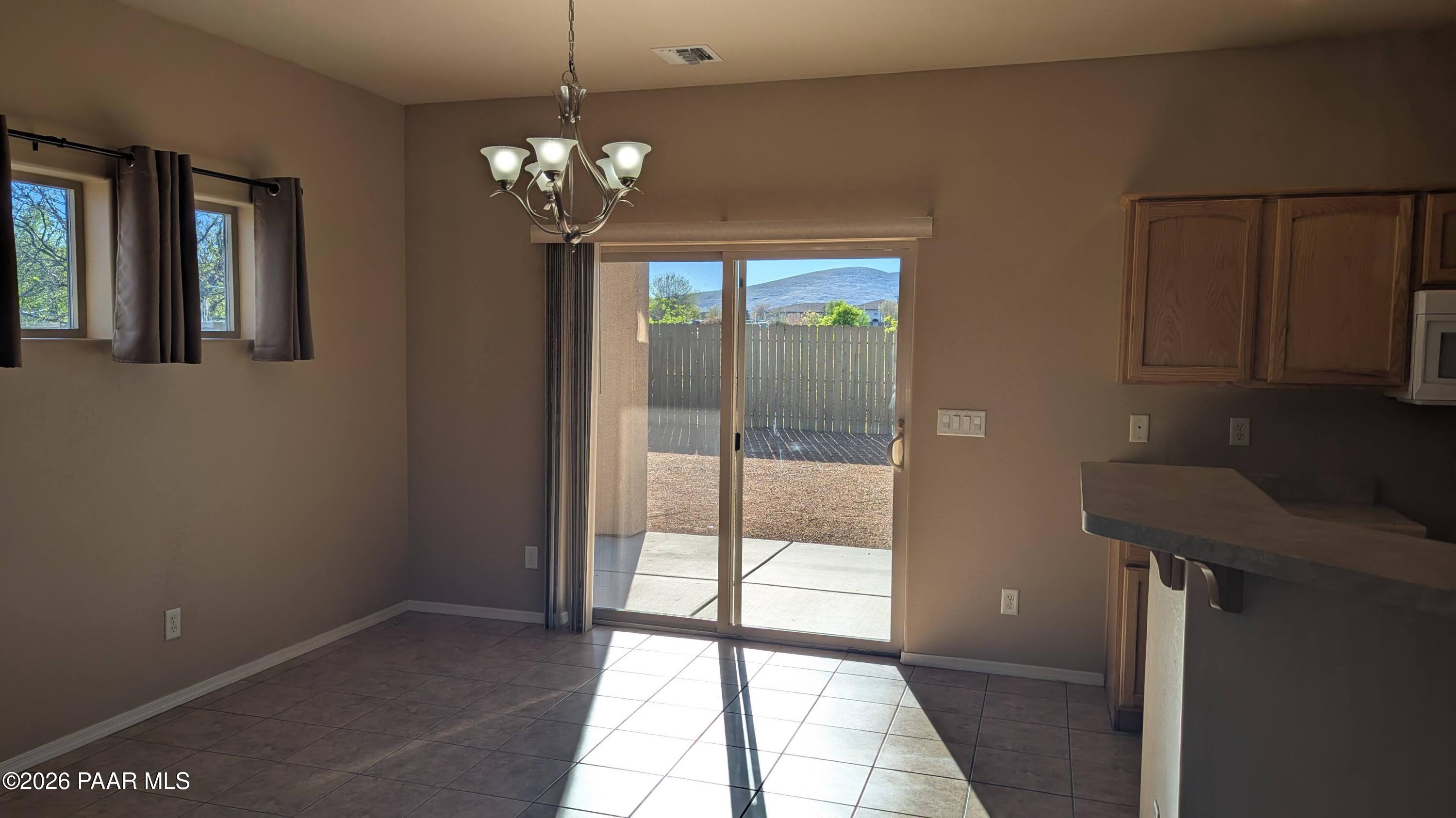 3416 North Victor Road, Unit 1 Prescott Valley, AZ 86314 - Photo 7 of 27 a view of a livingroom with a chandelier