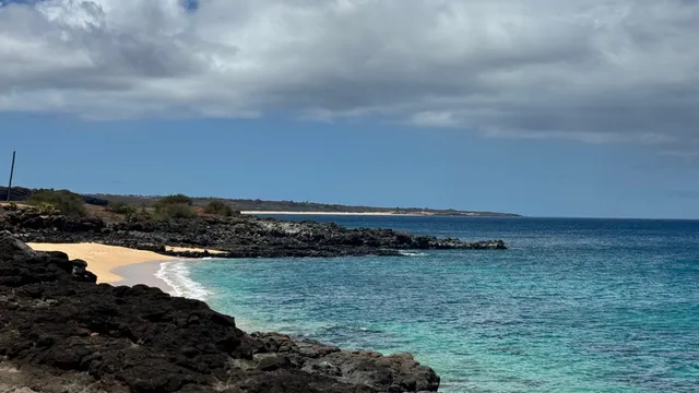a view of a lake and mountain in the back
