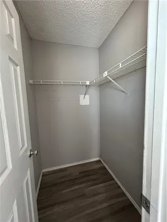 a view of an empty walk in closet