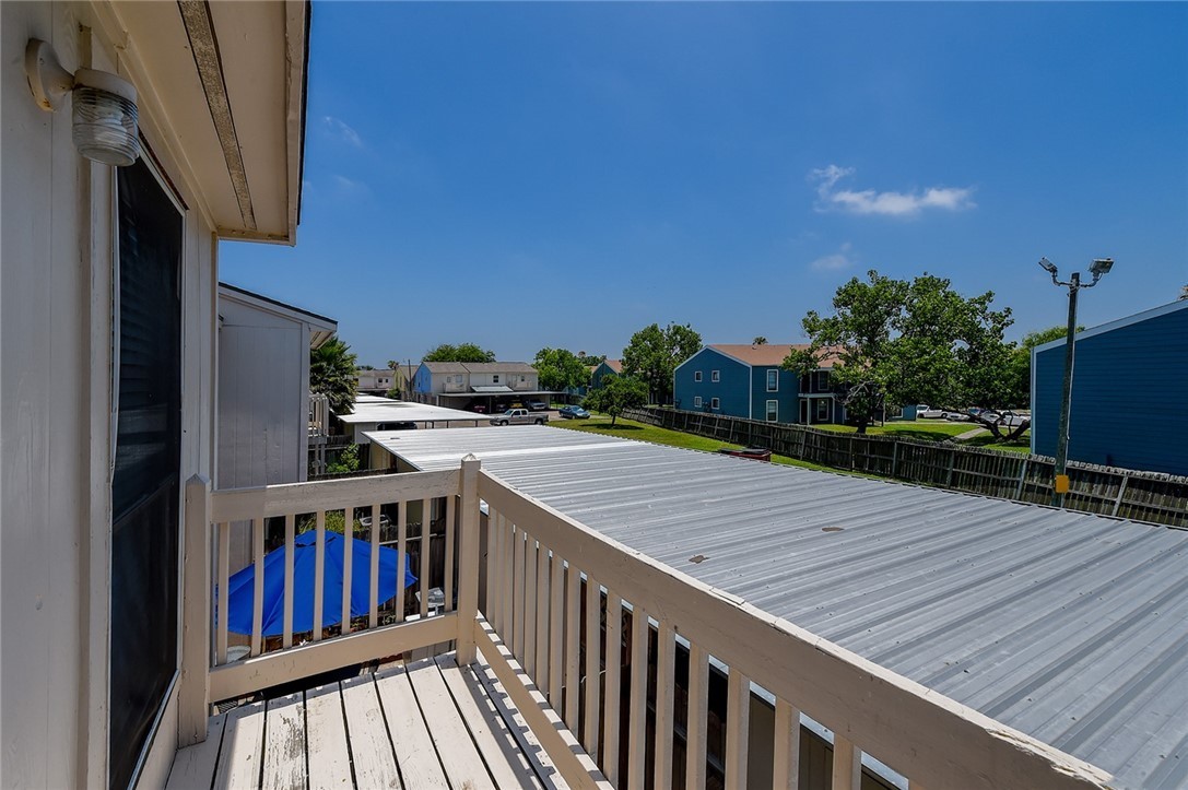 6702 Everhart Road, Unit I105 Corpus Christi, TX 78413 - Photo 16 of 19 a view of deck with patio