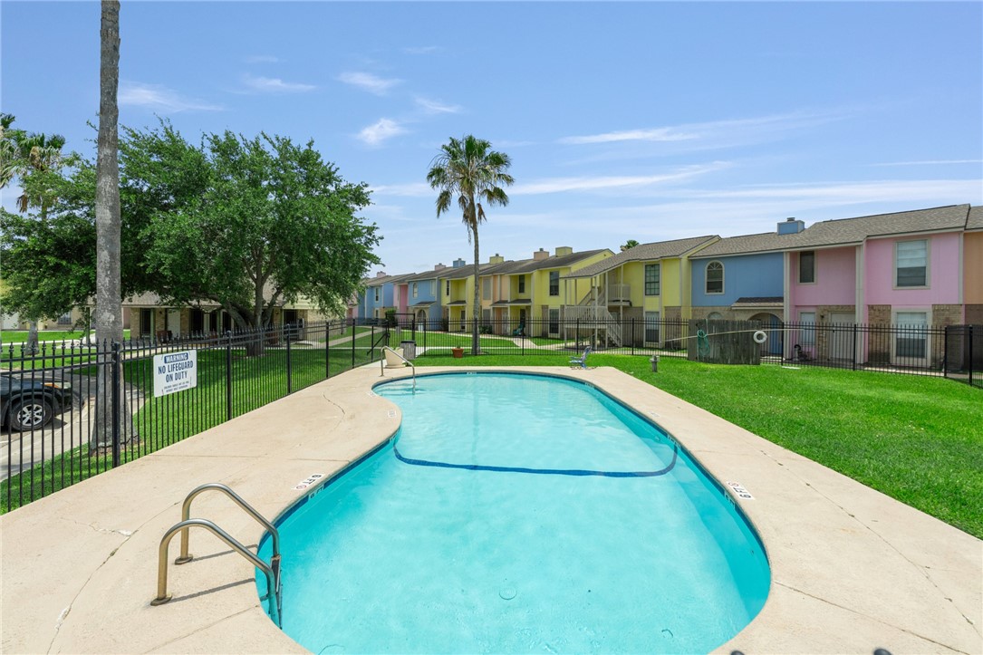 6702 Everhart Road, Unit I105 Corpus Christi, TX 78413 - Photo 17 of 19 a view of swimming pool with a garden